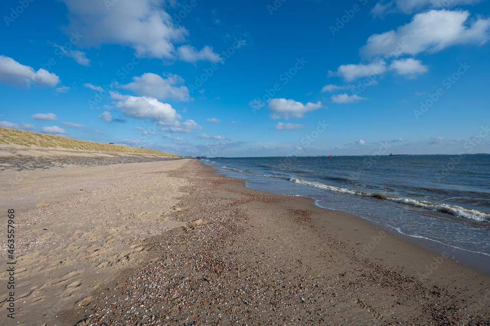 View on white sandy  beach, dunes and water of North sea between Vlissingen en Domburg, Zeeland, Netherlands