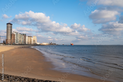 Waterfront, dunes and view on Vlissingen city with sandy beach on sunset © barmalini