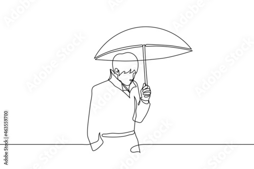 man in a raincoat holding an umbrella above him - one line drawing vector. concept of walking in rain or snow