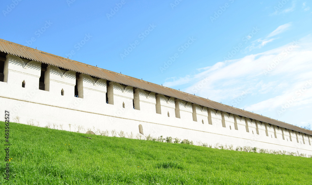 white brick wall with green grass