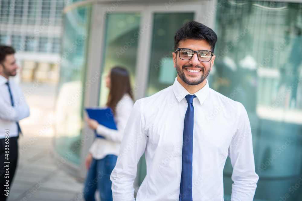 Businessman in front of a group of colleagues, teamwork concept Businessman in front of a group of colleagues, teamwork concept