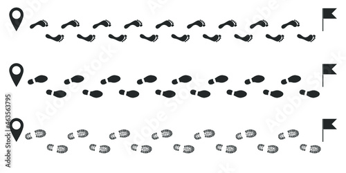 Footprints human icons set. Human trails in shoe and without. Traces of people black graphic signs isolated on white background. Vector illustration