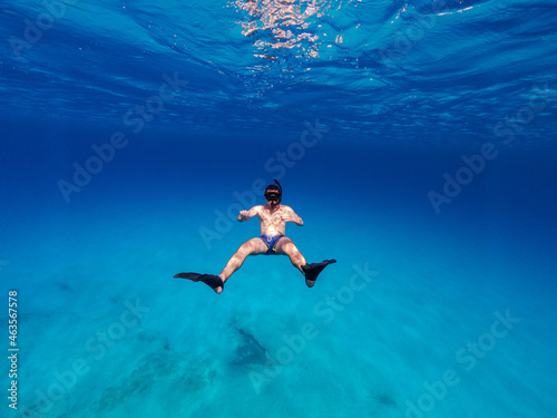 Underwater photo of man free diving in clear sea © Anton Tolmachov