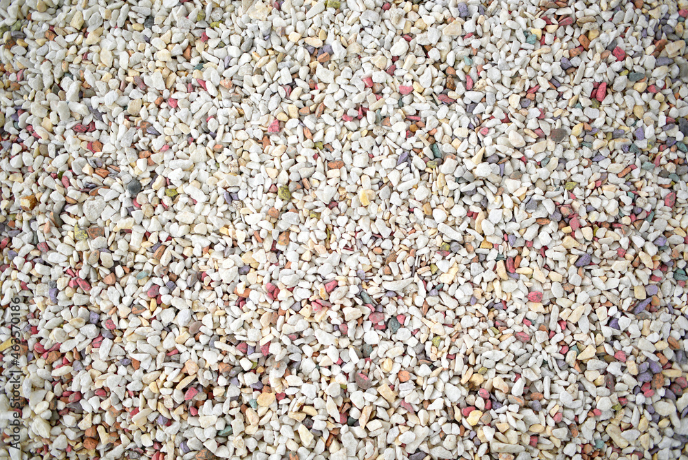 Beautiful multicolored pebbles in bulk. Top view