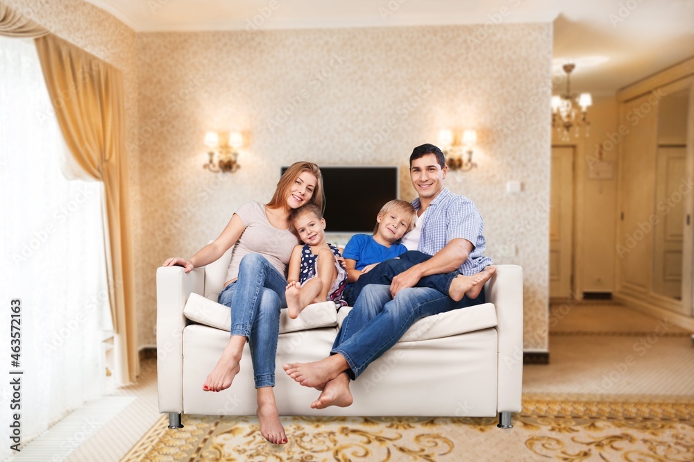 Cheerful happy young Family having Fun Together At Home Cheerful happy young Family having Fun Together At Home