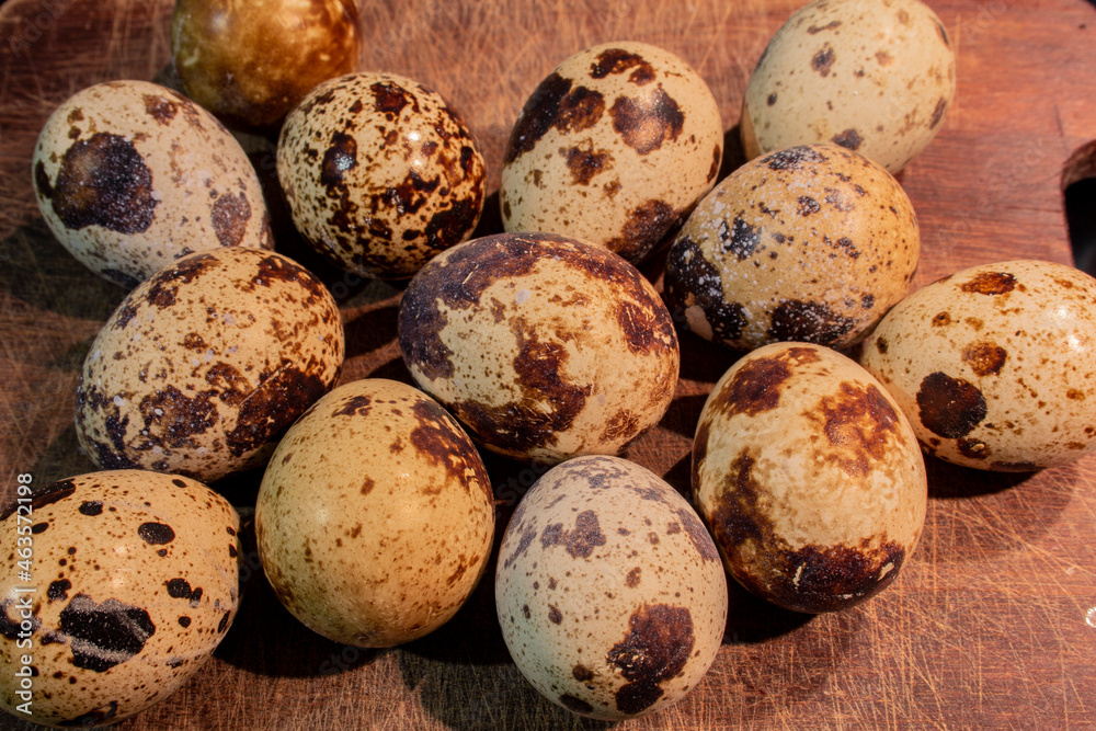 Quail eggs on the table. Several spotted quail eggs. Food Quail eggs on the table. Several spotted quail eggs. Food