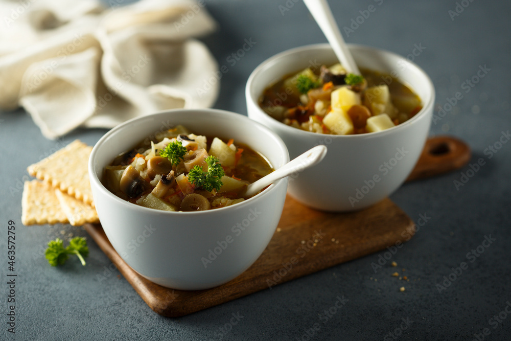 Traditional homemade mushroom soup with vegetables Traditional homemade mushroom soup with vegetables