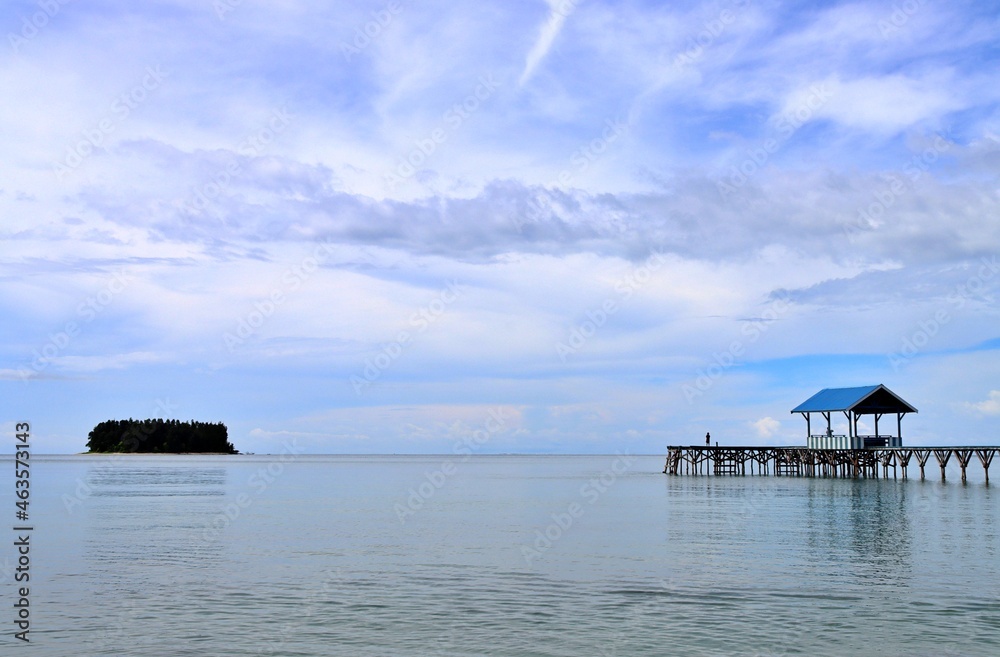 Small house on the sea and an island. showing panoramic view of clear sky Small house on the sea and an island. showing panoramic view of clear sky