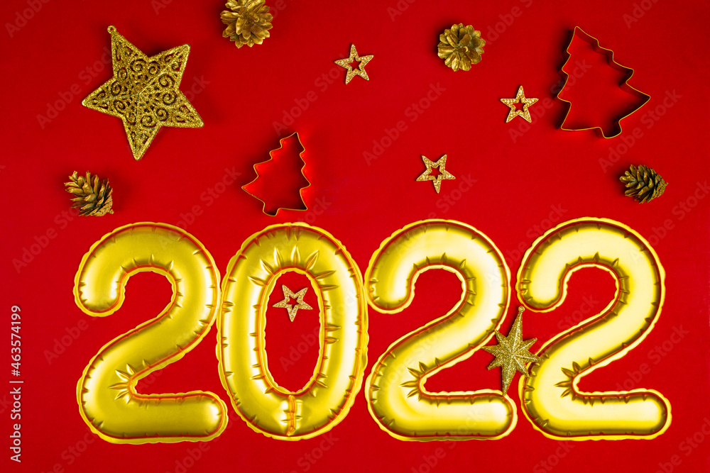 New Year's concept red background with golden decorations 2022 New Year's concept red background with golden decorations 2022