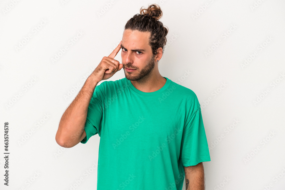Young caucasian man isolated on white background pointing temple with finger, thinking, focused on a task. Young caucasian man isolated on white background pointing temple with finger, thinking, focused on a task.