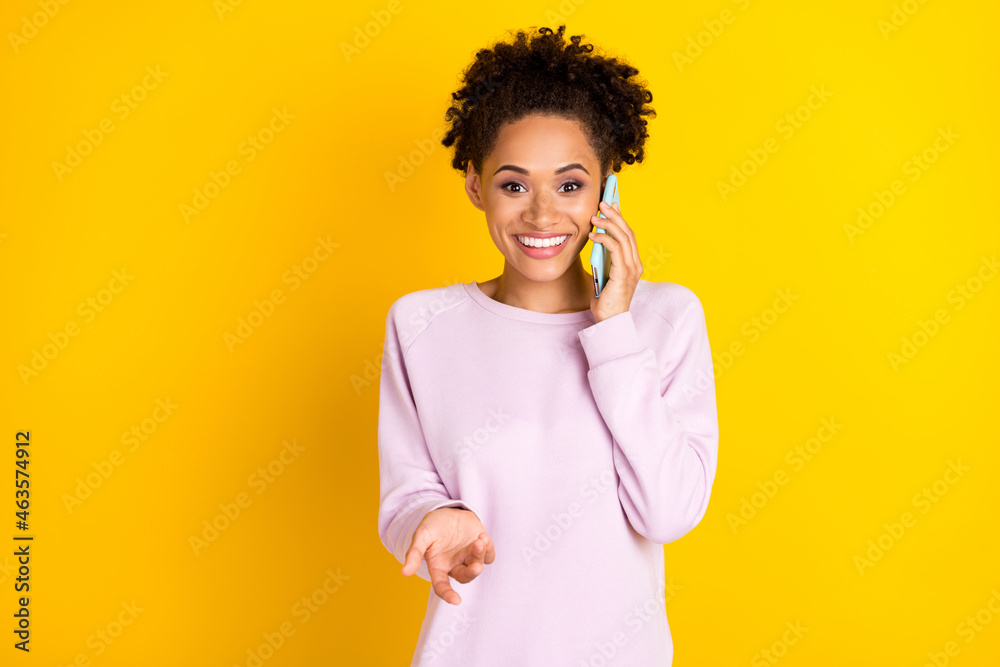 Photo of happy cheerful afro american woman talk phone smile good mood isolated on yellow color background Photo of happy cheerful afro american woman talk phone smile good mood isolated on yellow color background