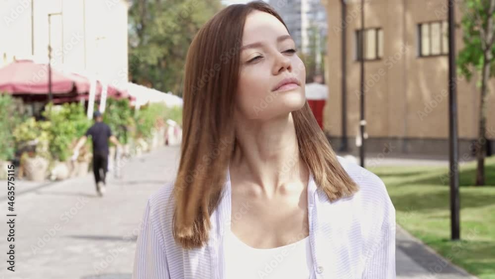 Portrait of pretty young woman walking at the street and drinking coffe. Nice summer day and good mood. Portrait of pretty young woman walking at the street and drinking coffe. Nice summer day and good mood.