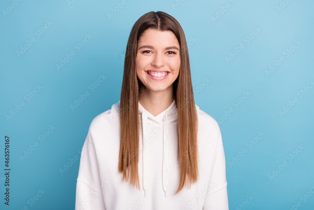 Photo portrait smiling woman in sportswear isolated pastel blue color background Photo portrait smiling woman in sportswear isolated pastel blue color background