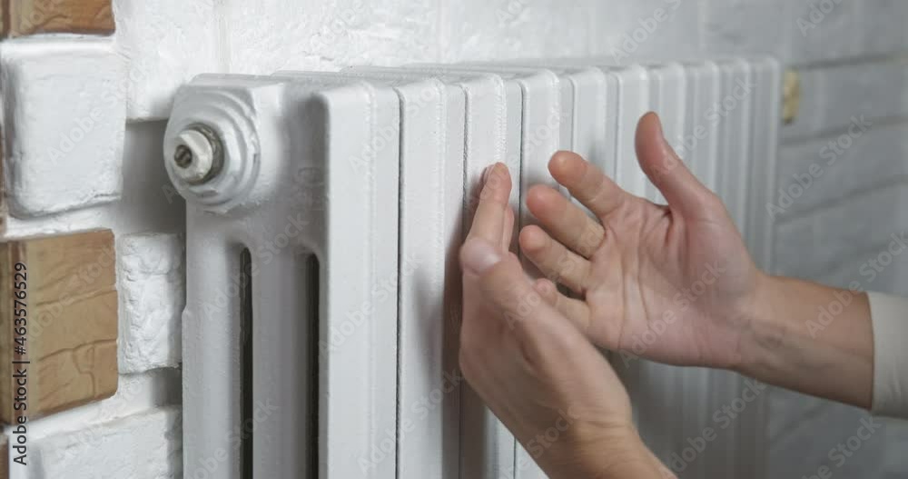 custom made wallpaper toronto digitalHands on hot radiator. A view of female hands on hot radiator system in the room.