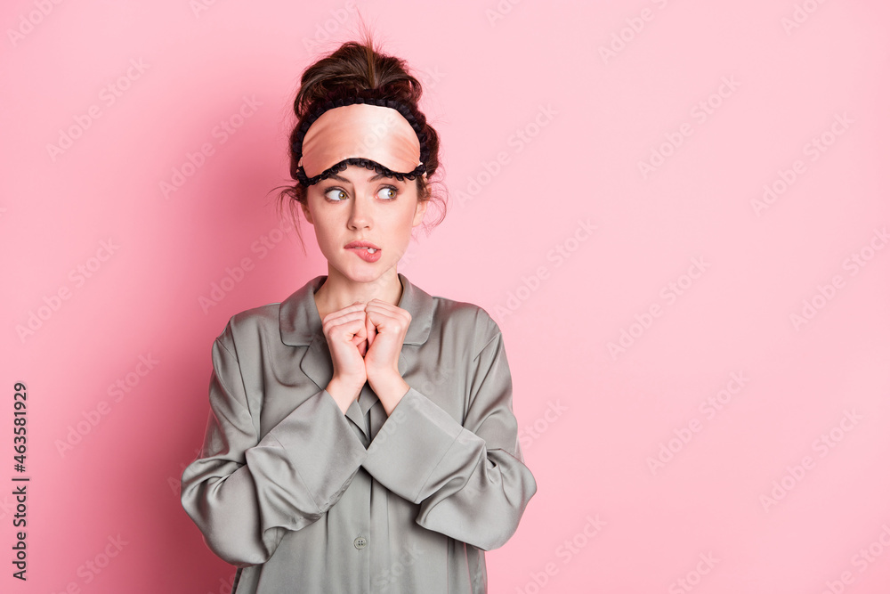 Portrait of attractive worried girlish girl thinking looking aside copy space ad isolated over pink pastel color background Portrait of attractive worried girlish girl thinking looking aside copy space ad isolated over pink pastel color background