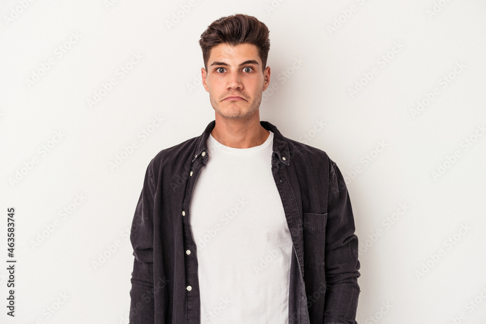 Young caucasian man isolated on white background sad, serious face, feeling miserable and displeased. Young caucasian man isolated on white background sad, serious face, feeling miserable and displeased.