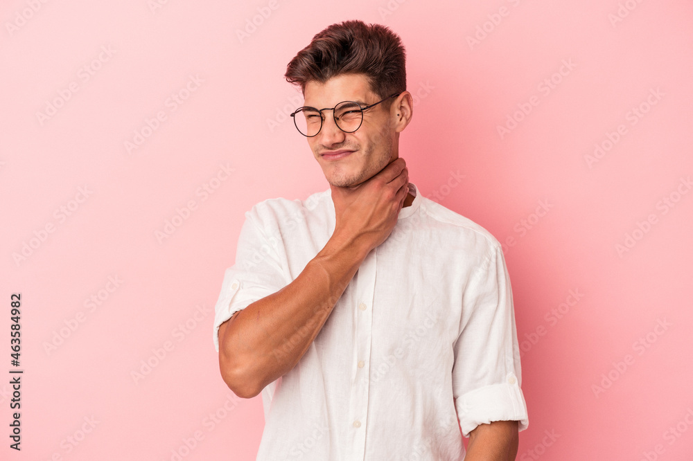 Young caucasian man isolated on pink background touching back of head, thinking and making a choice. Young caucasian man isolated on pink background touching back of head, thinking and making a choice.