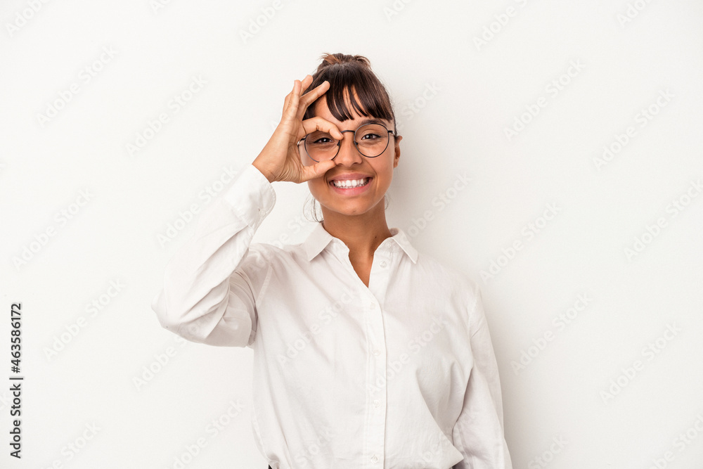Young mixed race business woman isolated on white background excited keeping ok gesture on eye. Young mixed race business woman isolated on white background excited keeping ok gesture on eye.