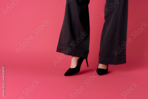 fashion women shoes posing cropped view pink background