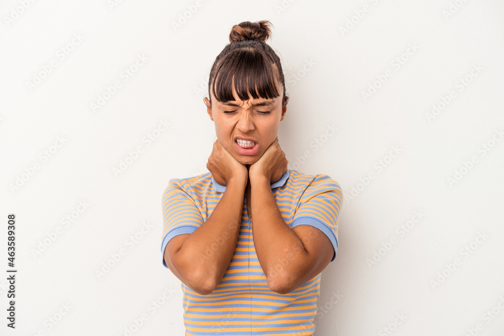 Young mixed race woman isolated on white background suffering neck pain due to sedentary lifestyle. Young mixed race woman isolated on white background suffering neck pain due to sedentary lifestyle.