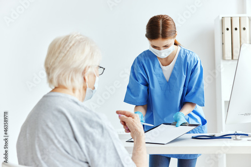 elderly woman and doctor Hospital visit checkup