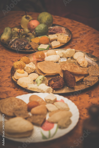 Delicious sweets, cakes and fruit dishes rich in many vitamins are arranged on the plate.