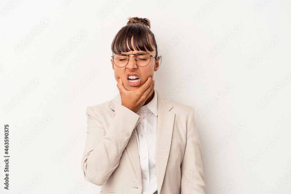Young mixed race woman isolated on white background having a strong teeth pain, molar ache. Young mixed race woman isolated on white background having a strong teeth pain, molar ache.