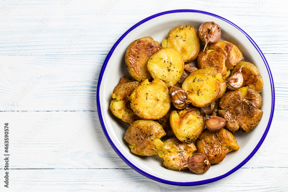 Crispy smashed baked potatoes. Top view, copy space. Crispy smashed baked potatoes. Top view, copy space.