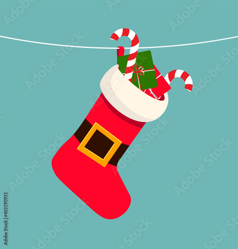 Cartoon red and white sock with gifts. Stocking hanging on a rope. Christmas and New year holiday. 