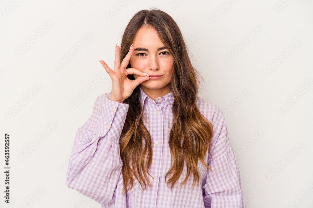 Young caucasian woman isolated on white background with fingers on lips keeping a secret. Young caucasian woman isolated on white background with fingers on lips keeping a secret.