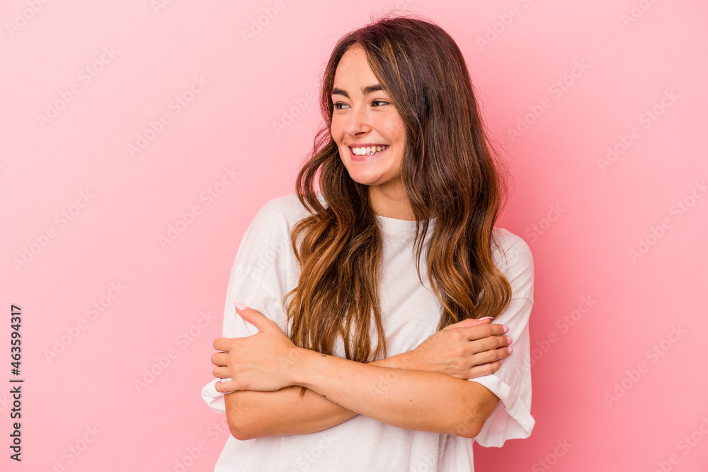 Young caucasian woman isolated on pink background smiling confident with crossed arms. Young caucasian woman isolated on pink background smiling confident with crossed arms.