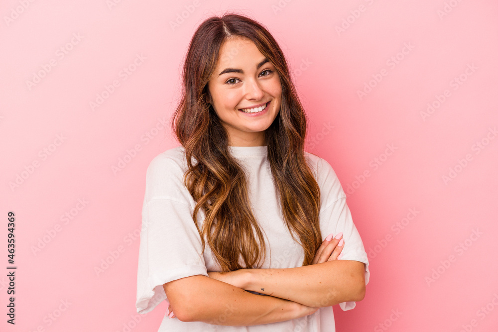 Young caucasian woman isolated on pink background happy, smiling and cheerful. Young caucasian woman isolated on pink background happy, smiling and cheerful.