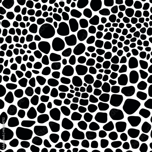 Seamless pattern of black pebbles. Vector