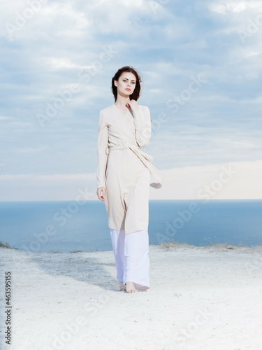 woman in coat posing beach fresh air lifestyle fashion