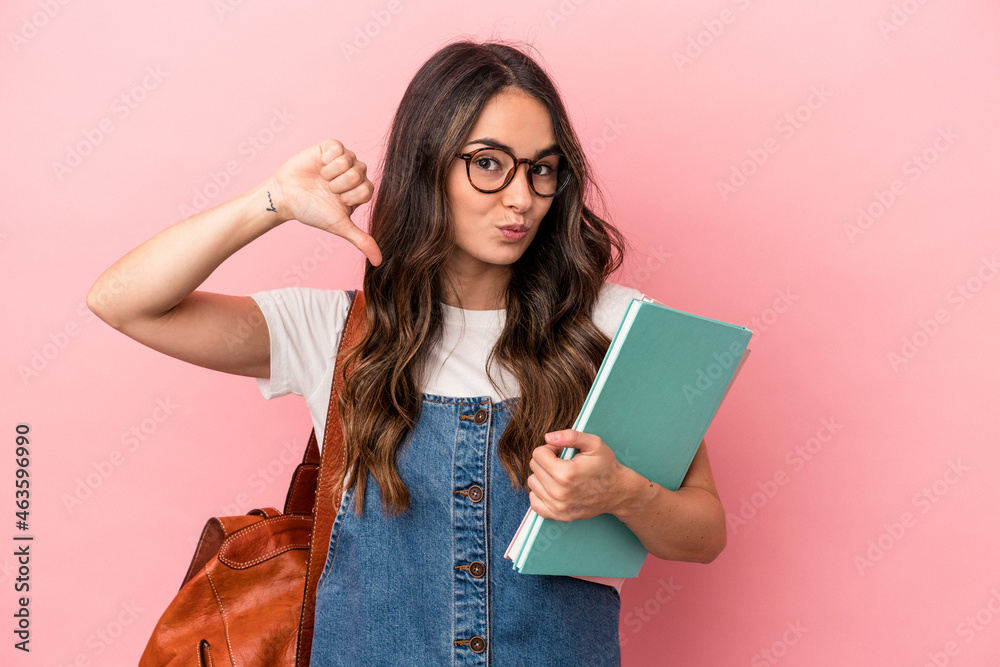 Young caucasian student woman isolated on pink background feels proud and self confident, example to follow. Young caucasian student woman isolated on pink background feels proud and self confident, example to follow.
