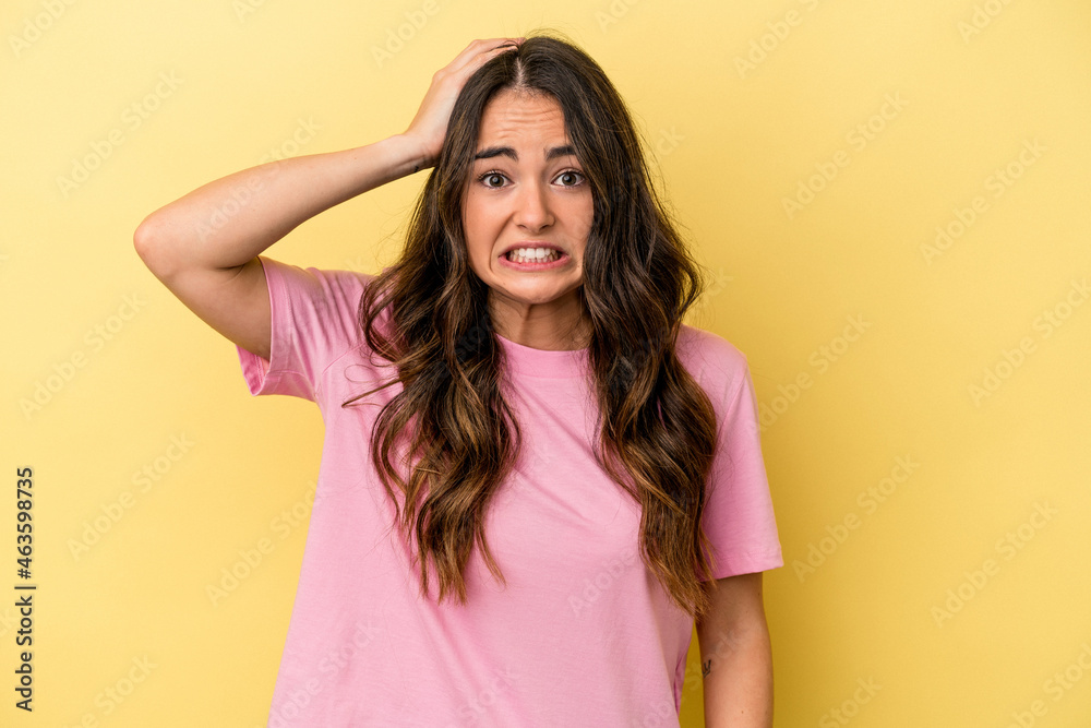 Young caucasian woman isolated on yellow background being shocked, she has remembered important meeting. Young caucasian woman isolated on yellow background being shocked, she has remembered important meeting.