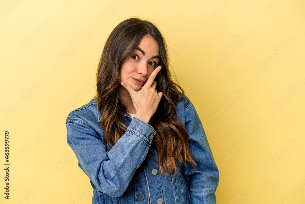 Young caucasian woman isolated on yellow background contemplating, planning a strategy, thinking about the way of a business. Young caucasian woman isolated on yellow background contemplating, planning a strategy, thinking about the way of a business.