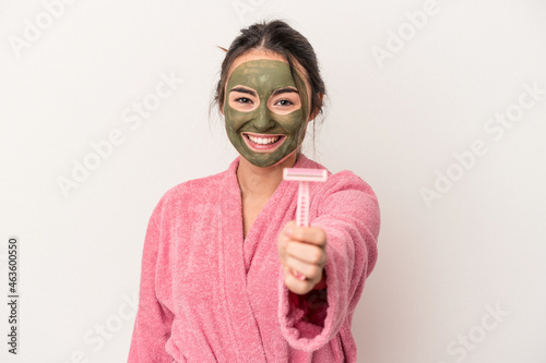 Young caucasian woman wearing a facial mask was isolated on white background