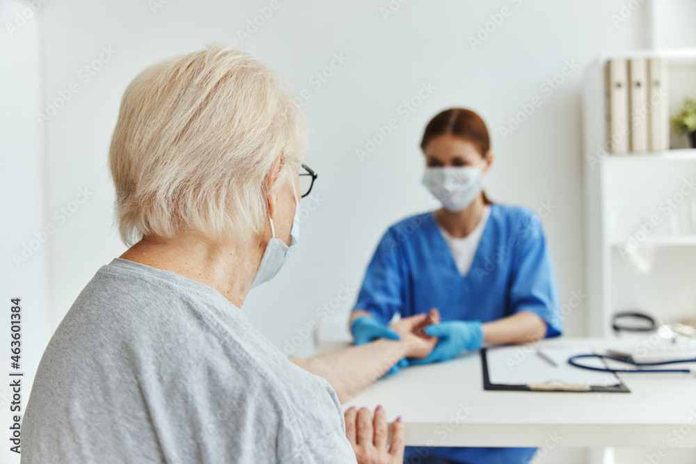 Fototapeta premium nurse and patient patient examination medical office