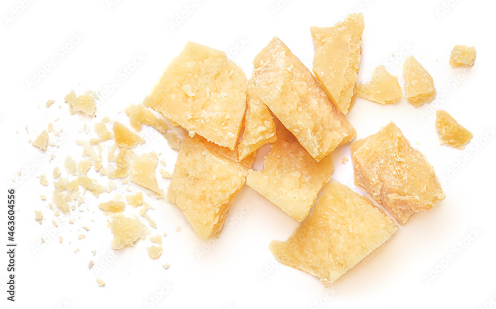 Pieces of parmesan cheese isolated on white background. Parmesan chunks with crumbs  top view - obrazy, fototapety, plakaty 