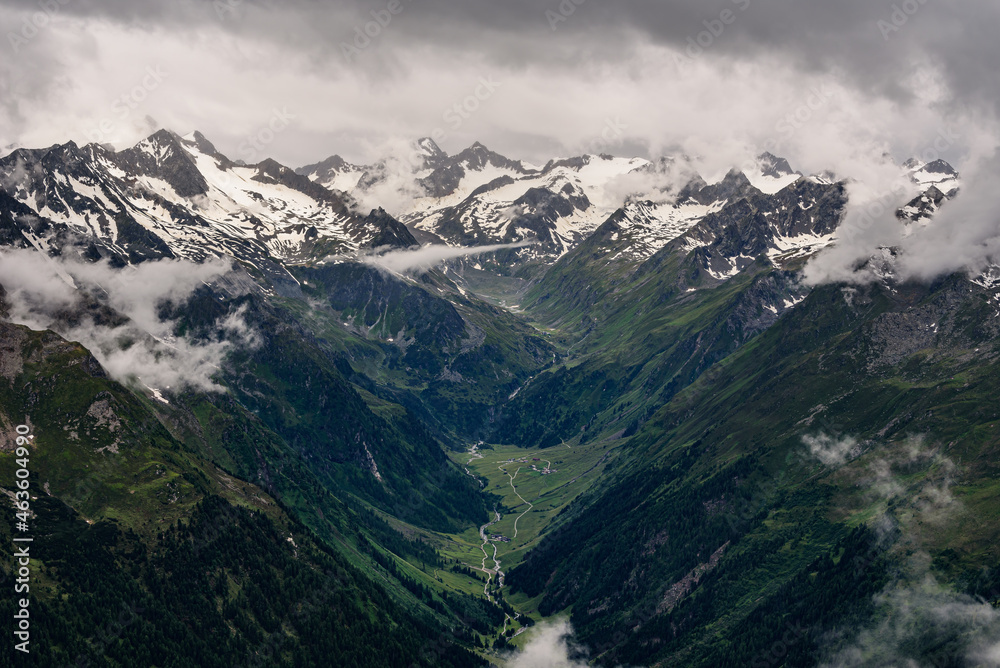 The Oberbergtal valley in austrian Stubai Alps in clouds.