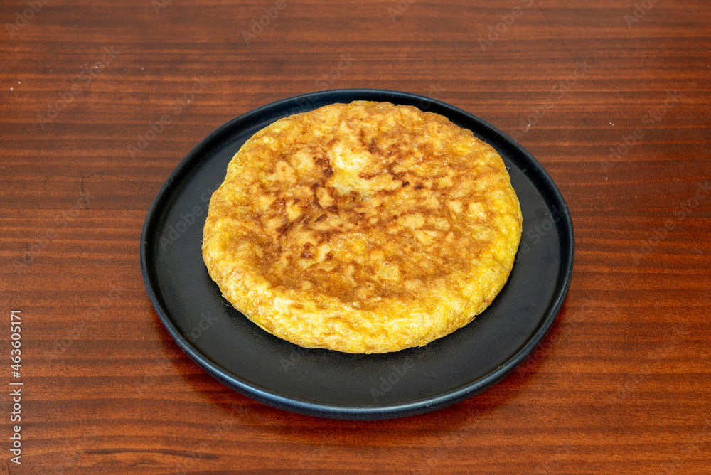 Traditional Spanish potato omelette served in a tapas restaurant Traditional Spanish potato omelette served in a tapas restaurant
