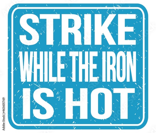 STRIKE WHILE THE IRON IS HOT, words on blue stamp sign