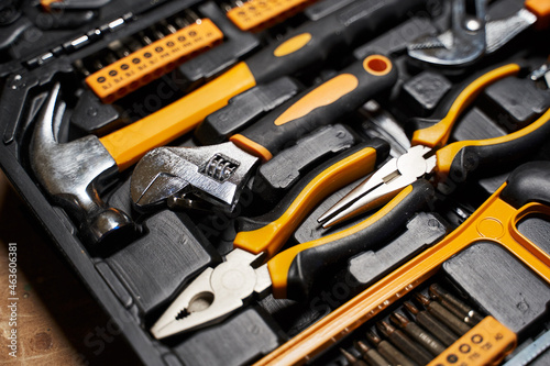 repair toolbox, various tools, hammer, pliers, screwdrivers, wrenches, drills