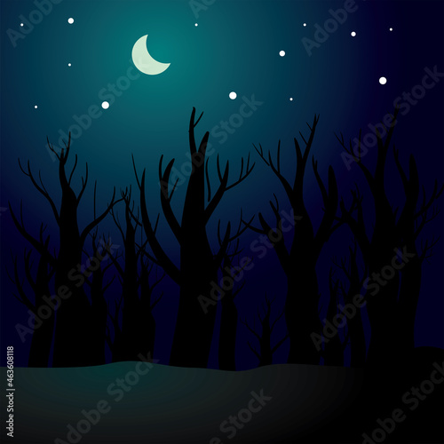 Spooky and creepy Halloween background consisting of a dry, dead forest silhouette at night, with a dark blue sky and moonlight. 