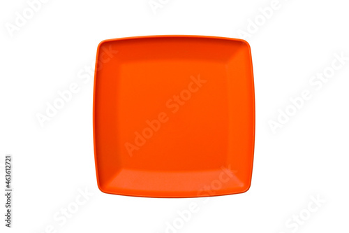 Orange plastic square plate isolated over white background. Top view