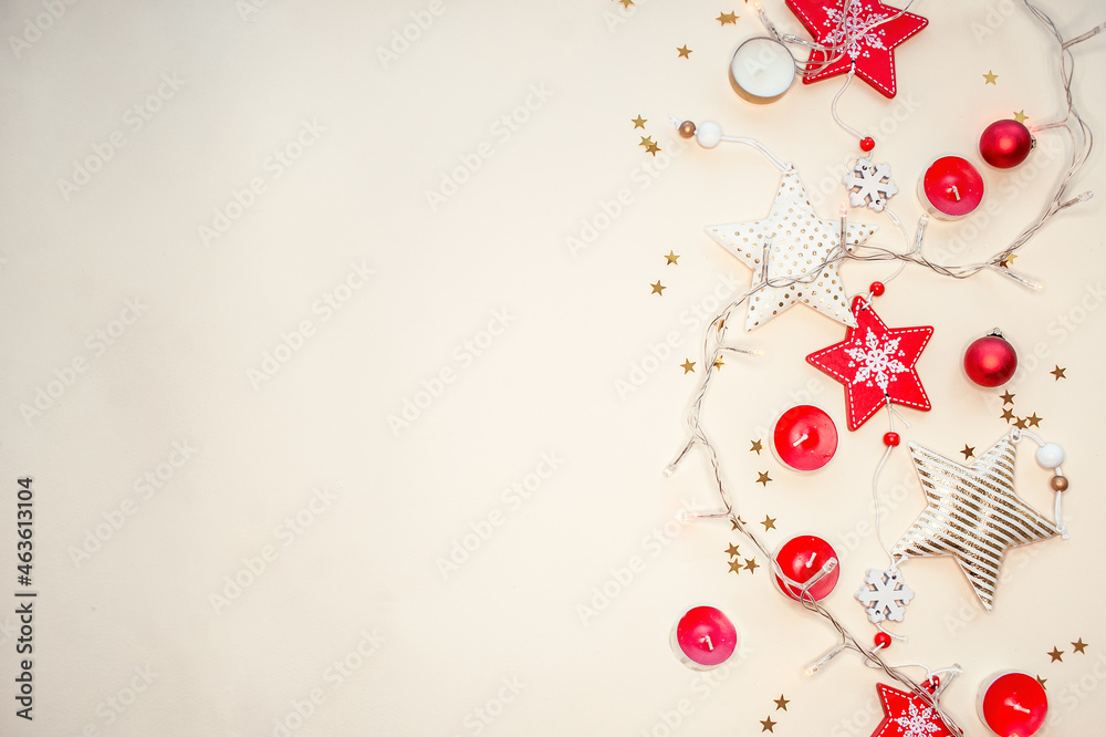 Christmas composition of wooden red and gold ornaments. New Year. Space for text. Beige background. flat lay.
