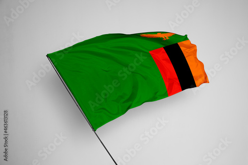 Zambia flag isolated on white background. close up waving flag of Zambia. flag symbols of Zambia. Concept of Zambia. photo