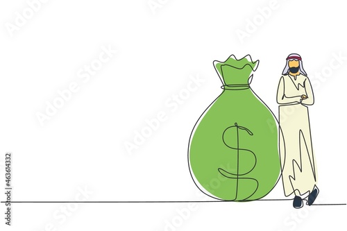 Single one line drawing Arabian businessman in traditional clothes standing near big heavy bag with dollar sign. Successful male leaning on money sack. Continuous line draw design vector illustration