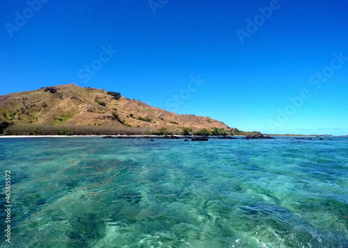 Clear blue water around an island in Fiji